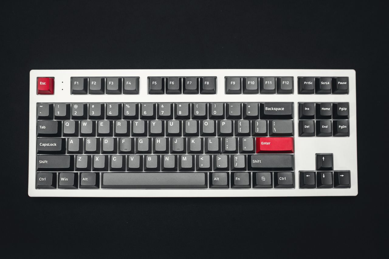 A mechanical keyboard with a red escape key